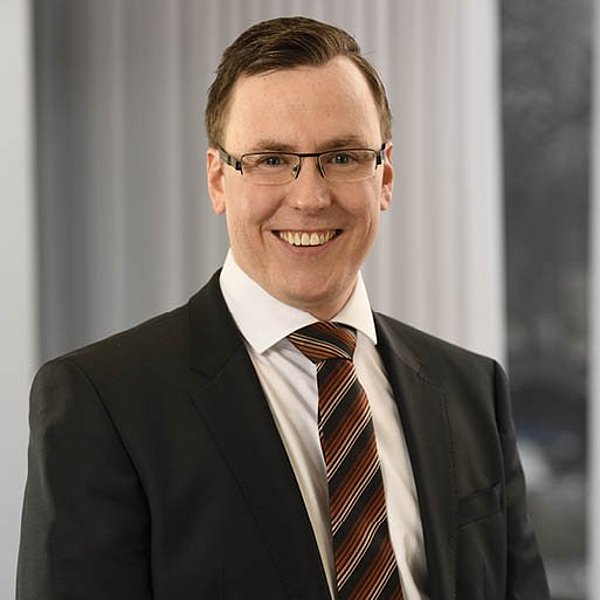 Leiter der Betriebsverpflegung Christian Löffler von apetito catering lächelnd im Portrait